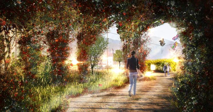 Gartenanlage mit üppiger Bepflanzung, bunten Windspielen und Hofburg im Hintergrund.